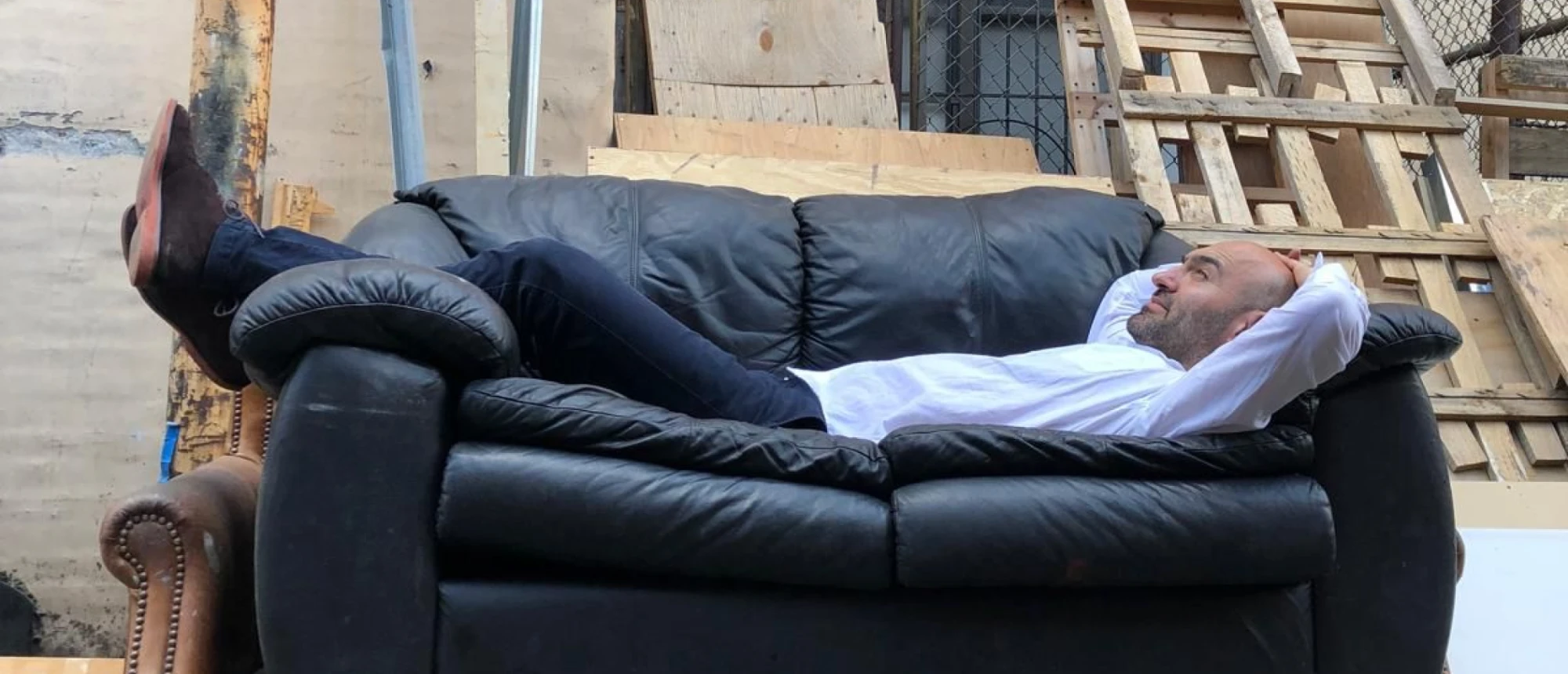 GORZO resting on a leather sofa in the yard of the UZUC factory